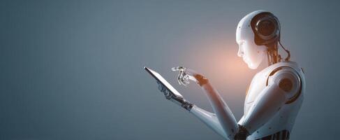 The advanced humanoid robot interacting with a digital tablet in a futuristic setting. photo