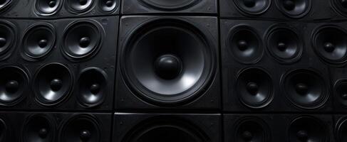 The massive collection of black speakers creating an immersive sound experience. photo