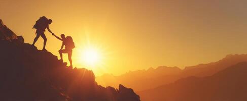 The climbers reaching out to each other during a breathtaking sunset adventure photo