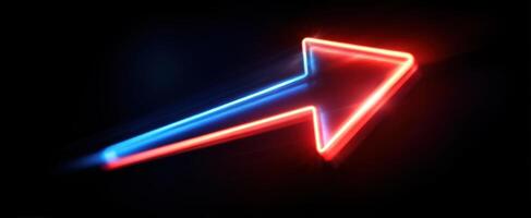 The vibrant neon arrow glowing in a dark background representing direction and motion. photo