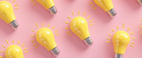 The vibrant yellow lightbulbs illuminating creativity on a pink background. photo