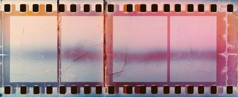 The vintage film strip with empty frames and soft pastel colors. photo