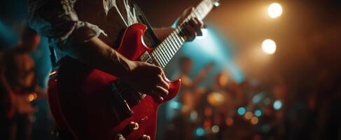 The electric guitar highlighted in a vibrant live music performance. photo