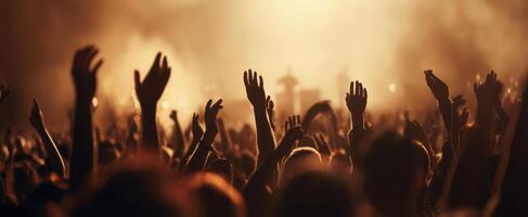 The crowd celebrating at a vibrant live music concert under dramatic lighting. photo
