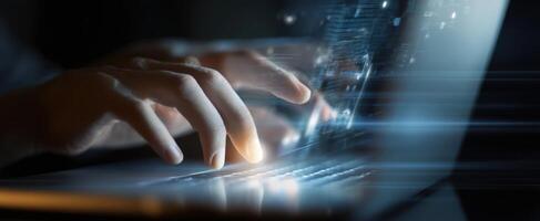 The hands typing on a laptop with a futuristic digital interface. photo