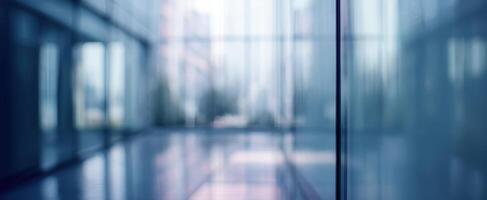 The serene glass facade reflecting subtle urban elements and light patterns. photo
