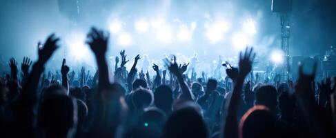 The energetic crowd at a vibrant concert celebrating live music and performance. photo