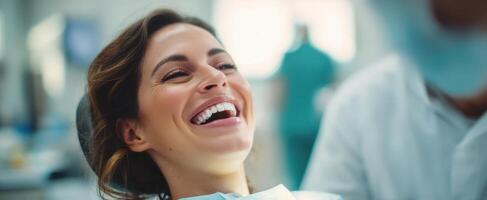 The smiling woman enjoying a dental check-up in a modern clinic environment. photo