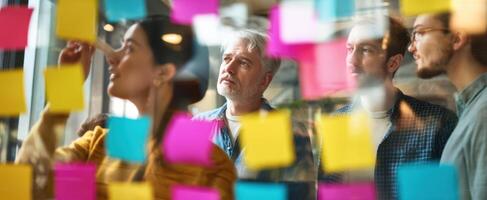 The creative brainstorming session with colorful sticky notes in an office environment. photo
