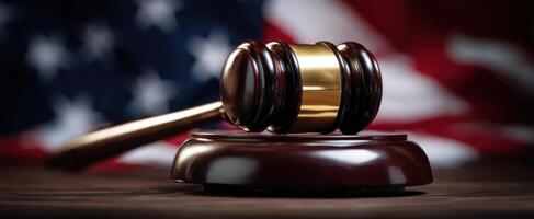 The gavel representing law and justice against the backdrop of the American flag. photo