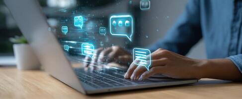 The laptop displaying digital messaging icons for modern communication solutions. photo