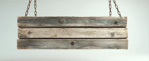 The rustic wooden sign hanging from chains against a plain background. photo