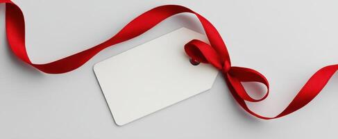 The Elegant Red Ribbon and Blank Gift Tag on a Minimalist Background photo