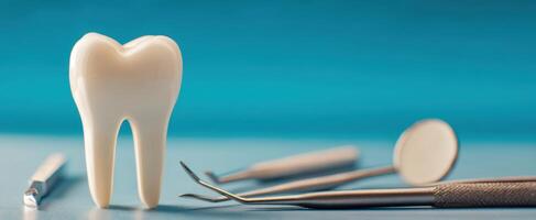 The tooth surrounded by dental instruments on a blue background. photo