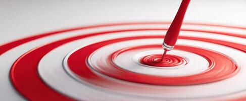 The Red Paint Drip Creating Circular Ripples on a White Surface photo