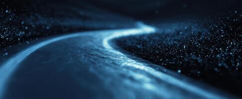 The mesmerizing blue waves illuminated by starlight in a serene landscape. photo