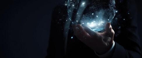 The glowing globe held by a businessman in a dark and mysterious setting photo