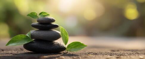 The Balanced Stacked Stones Surrounded by Fresh Green Leaves in Nature. photo
