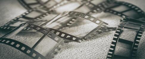 The vintage film negatives artistically arranged on a textured surface. photo