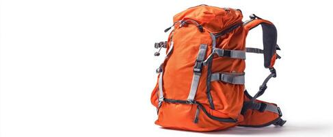The vibrant orange backpack ready for outdoor adventures and exploration. photo