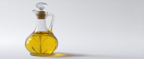The elegant glass bottle of infused olive oil with herbs on a light background photo