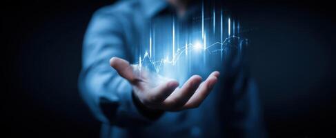 The Hand Displaying Futuristic Digital Growth Chart and Financial Metrics photo