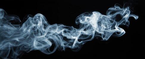 The Ethereal Beauty of Wispy Smoke Against a Black Background photo
