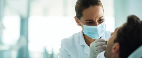 The dentist performing a check-up on a patient in a modern clinic setting. photo