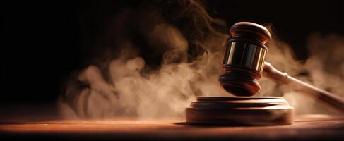 The gavel striking in a moody and dramatic courtroom setting photo