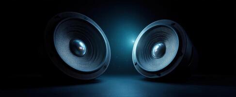 The dynamic dual speakers illuminated in a dark, moody atmosphere. photo
