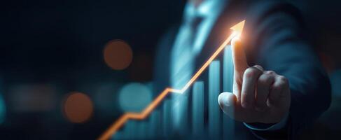 The businessman pointing to an upward trend in financial growth and success. photo