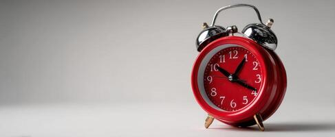 The vibrant red alarm clock highlighting the importance of timekeeping in daily life. photo