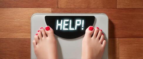 The scale displaying a message of urgency for weight management assistance. photo