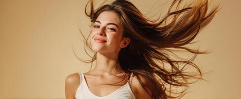 The joyful young woman with flowing hair exuding confidence and happiness. photo