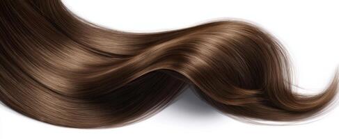 The beautiful flowing strands of glossy brown hair on a white background photo