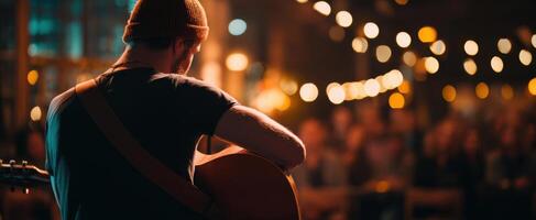 The musician captivating an audience with a soulful guitar performance at night. photo