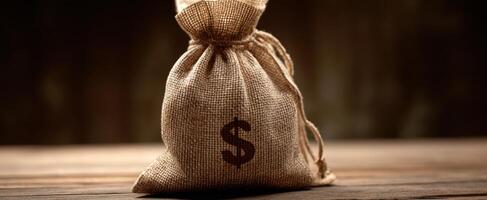 The burlap money sack symbolizes wealth and financial prosperity. photo