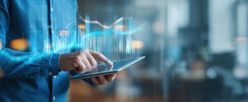 The user interacting with a tablet displaying financial data and analytics. photo