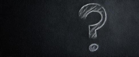 The question mark symbolizing curiosity and the quest for knowledge on a chalkboard. photo
