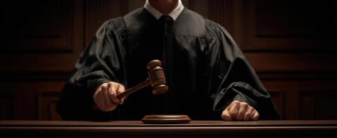 The judge holds a gavel, symbolizing authority and decision-making in the courtroom. photo