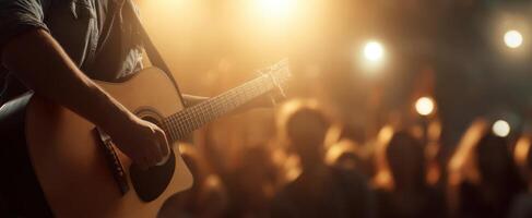 The Musician Playing Acoustic Guitar on Stage Surrounded by an Enthusiastic Crowd photo