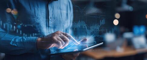 The business professional analyzing data with a modern tablet and digital graphs. photo