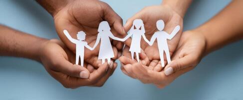 The Family Holding Paper Cutouts Together in Unity and Love photo
