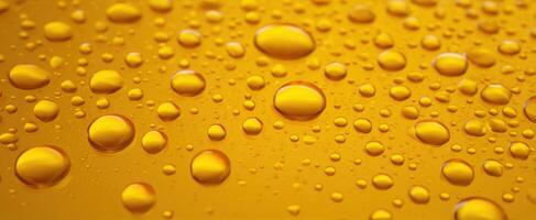 The Close-Up View of Yellow Water Droplets on a Smooth Surface photo
