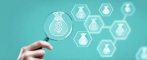 The magnifying glass revealing insights into financial opportunities and investments. photo