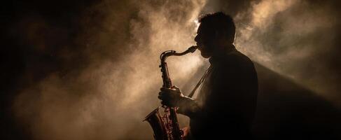 The saxophone player creates a mesmerizing atmosphere in smoky ambiance. photo