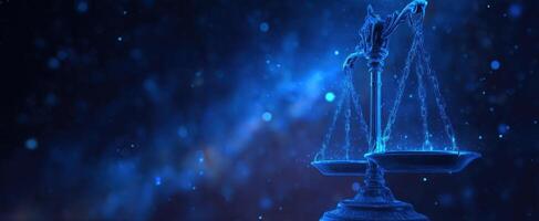 The scales of justice illuminated in a mesmerizing blue abstract background. photo