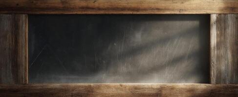 The rustic wooden frame surrounding a blank chalkboard ready for messages. photo