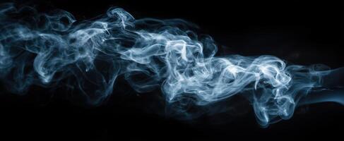 The ethereal beauty of swirling smoke against a dramatic black background. photo