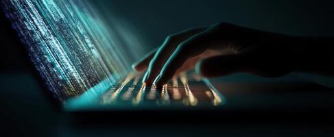 The illuminated keyboard with fingers typing in a dark, digital environment. photo